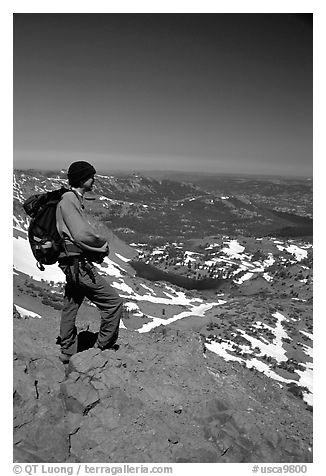 Hiker standing on top of Round Top Mountain. Mokelumne Wilderness, Eldorado National Forest, California, USA