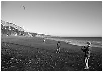 Flying a kite at Santa Maria Beach, late afternoon. Point Reyes National Seashore, California, USA (black and white)