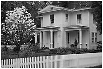 White picket fence and house, Essex. Connecticut, USA ( black and white)