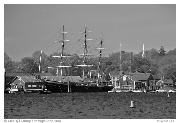 Three masted ship, Mystic River, and church. Mystic, Connecticut, USA (black and white)