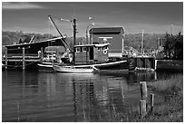 Boats and reflections at shipyard. Mystic, Connecticut, USA (black and white)
