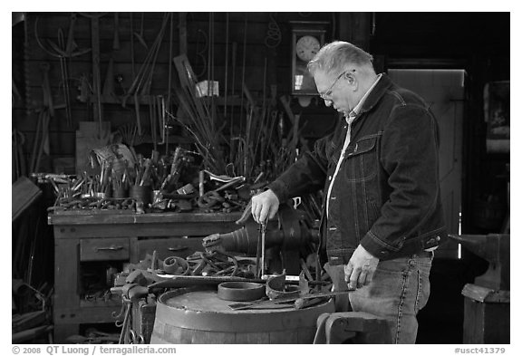 Man in ironwork shop. Mystic, Connecticut, USA