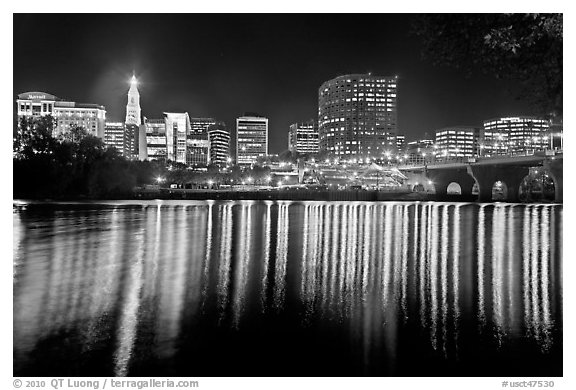 Skyline of Hartford reflected in Connecticut River at night. Hartford, Connecticut, USA (black and white)