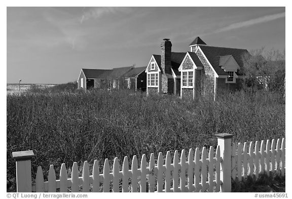 Fence and cottages in winter, Truro. Cape Cod, Massachussets, USA