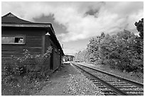 Railroad track and abandonned station, Greenville Junction. Maine, USA (black and white)