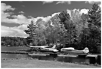 Floatplanes and fall foliage on Moosehead Lake, Greenville. Maine, USA (black and white)