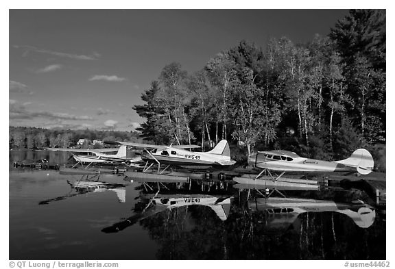 Floatplanes and reflections in Moosehead Lake  late afternoon, Greenville. Maine, USA (black and white)