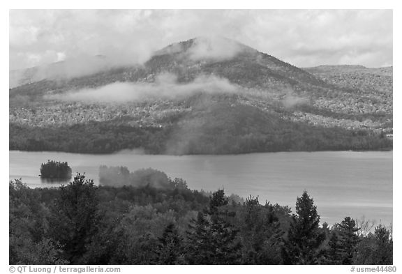 Autumn scenery with lake and clouds lifting up. Maine, USA (black and white)