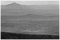 Distant hills rising above forested slopes in fall foliage. Baxter State Park, Maine, USA ( black and white)