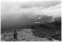 Hiker descending South Turner Mountain under the rain. Baxter State Park, Maine, USA ( black and white)