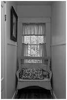 Corridor in inn with chair and window looking out to trees. Maine, USA (black and white)