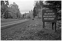 Road with Allagash wilderness sign. Allagash Wilderness Waterway, Maine, USA ( black and white)