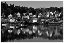 Reflection of hillside houses. Stonington, Maine, USA (black and white)