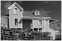 Lobster traps lined in front of house. Stonington, Maine, USA (black and white)