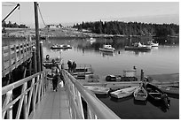 Passengers headed towards mailboat. Isle Au Haut, Maine, USA ( black and white)