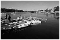 Small boats, harbor and village. Isle Au Haut, Maine, USA (black and white)