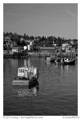 Traditional lobster boats and houses, late afternoon. Stonington, Maine, USA