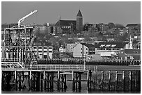Pier and hillside buildings across harbor. Portland, Maine, USA ( black and white)