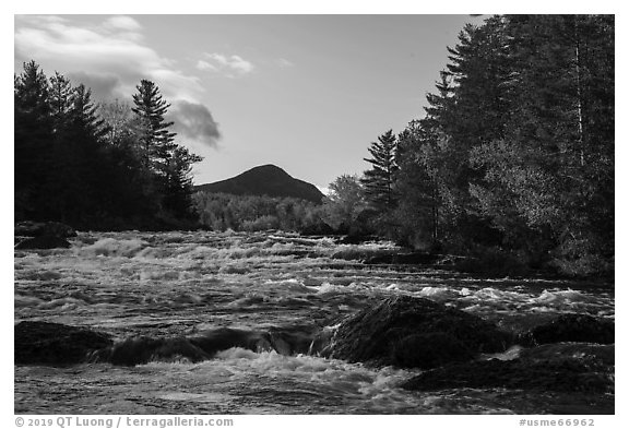 Haskell Rock Pitch cascades and Bald Mountain framed by trees in autumn foliage. Katahdin Woods and Waters National Monument, Maine, USA (black and white)