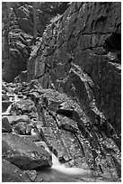 Flume brook at the base of granite and basalt walls, Franconia Notch State Park. New Hampshire, USA ( black and white)