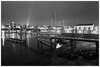 Pier and skyline by night. Portsmouth, New Hampshire, USA (black and white)