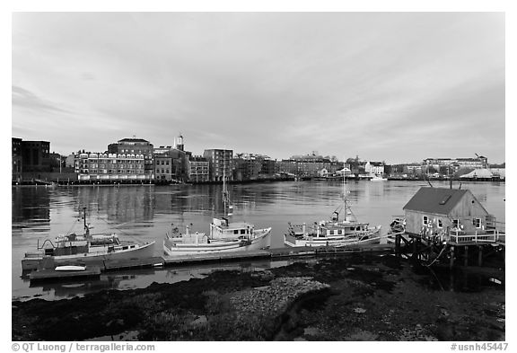 Boats, river, and skyline, early morning. Portsmouth, New Hampshire, USA