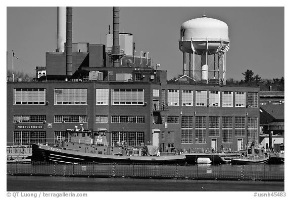 Tugboats and brick buildings, Naval Shipyard. Portsmouth, New Hampshire, USA