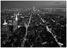 Streets at night from above with twin towers in background. NYC, New York, USA (black and white)