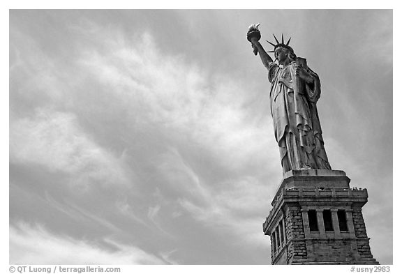 Statue of Liberty and pedestal against sky. NYC, New York, USA (black and white)