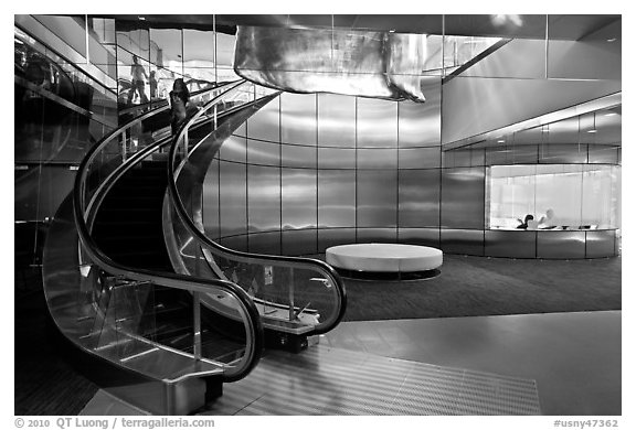 Curved moving staircase and meeeting room, Bloomberg building. NYC, New York, USA