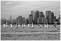 Sailboats, lower and mid Manhattan skyline. NYC, New York, USA (black and white)