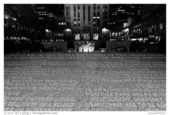 Rockefeller plaza and rink by night with Credo plaque. NYC, New York, USA