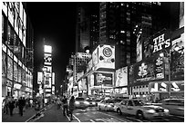 Yellow taxicabs, Times Squares at night. NYC, New York, USA ( black and white)