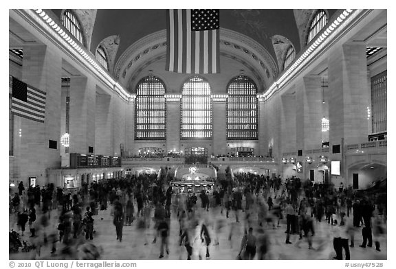 Dense crowds in  main concourse of Grand Central terminal. NYC, New York, USA (black and white)