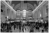 Dense crowds in  main concourse of Grand Central terminal. NYC, New York, USA (black and white)