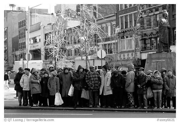 Gathering in Chinatown in winter. NYC, New York, USA