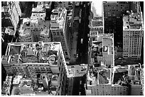 Canyon-like streets and yellow cabs seen from the Empire State building. NYC, New York, USA ( black and white)