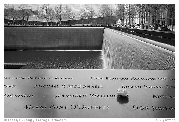 Names incribed on bronze parapets, waterfalls, National September 11 Memorial. NYC, New York, USA (black and white)
