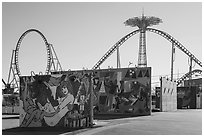 Murals and roller coaster, Coney Island. New York, USA ( black and white)