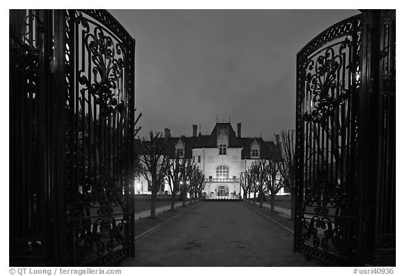 Entrance gate and historic mansion building at night. Newport, Rhode Island, USA