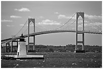 Newport Harbor lighthouse, Newport Bridge, and Narragansett Bay. Newport, Rhode Island, USA ( black and white)