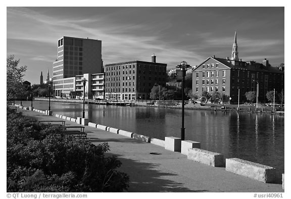 Brick buildings reflected in Seekonk river, late afternoon. Providence, Rhode Island, USA