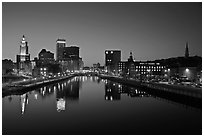 Wide view of downtown buildings reflected in Seekonk river at dusk. Providence, Rhode Island, USA (black and white)