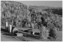 Farm surrounded by hills in fall foliage. Vermont, New England, USA (black and white)