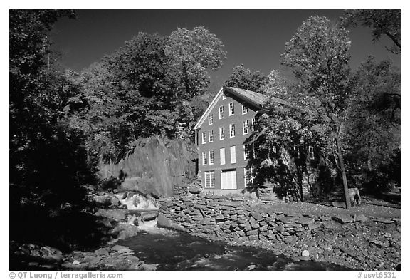 Old Mill next to a cascading brook near Stowe. Vermont, New England, USA (black and white)