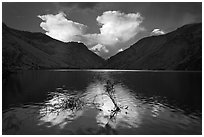 Thunderstorm clouds at sunrise reflected in reservoir. Hells Canyon National Recreation Area, Idaho and Oregon, USA ( black and white)