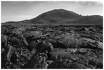Lava flow and Big Cinder Butte. Craters of the Moon National Monument and Preserve, Idaho, USA ( black and white)