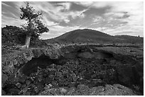 Buffalo Cave collpased roof and and Big Cinder Butte. Craters of the Moon National Monument and Preserve, Idaho, USA ( black and white)