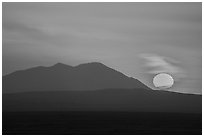 Sun rising and Big Southern Butte. Craters of the Moon National Monument and Preserve, Idaho, USA ( black and white)