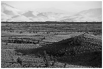Snake River Plain with cinder cones and Pioneer Mountains. Craters of the Moon National Monument and Preserve, Idaho, USA ( black and white)